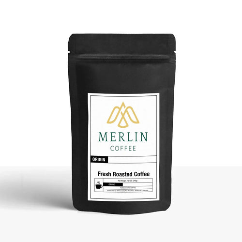 Black 12oz coffee bag with Merlin Coffee logo and fresh roasted coffee label